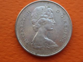 1867 - 1967 Centennial Canadian Quarter (25c Silver Coin).  1447 photo