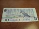 1986 $5.  00 Note - Uncirculated Canada photo 1