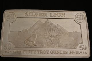50 Troy Oz Silver Bar.  999 Pure - Male Lion With Pyramids In Background photo