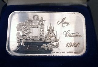 One Troy Ounce.  999 Fine Silver Bar,  1982 Christmas Santa California Crown photo