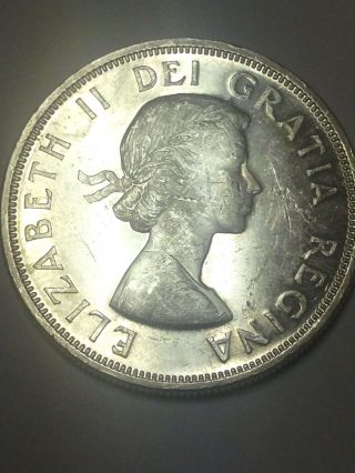 Uncirculated 1964 Canadian One Dollar Silver 80 Silver. photo