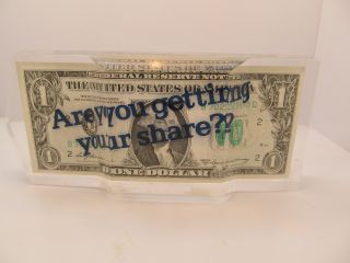 A Lucite Embedded Dollar Bill,  Series 1969a,  With The American Can Logo photo