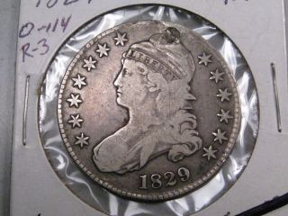 1829 Silver Us Bust Half Dollar.  Grades @ F/vf But Plugged.  Card Says O - 114,  R - 3 photo