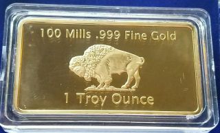 1 Troy Ounce Gold Buffalo Bar 100 Mills Clad.  999 24k Bullion Bar. photo