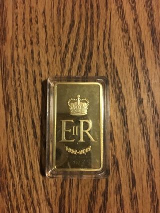 1oz Queen Elizabeth 999/1000 24k Gold Bar photo