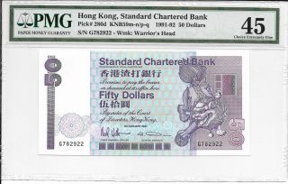 Standard Chartered Bank - $50,  1991.  Pmg 45.  Crown Logo. photo