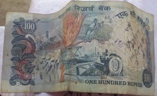 A Very Rare 100 Rupee Note With Sign By R N Malhotra And Tractor Symbol On Back. photo