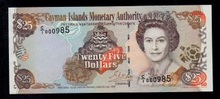 Cayman Islands 25 Dollars 1998 C/1 Low 000985 Pick 24 Unc -.  Banknote. photo