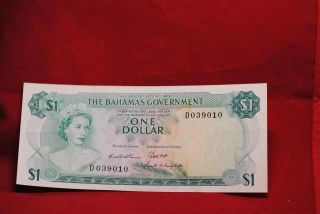 Bahamas Currency: 1.  00 1965 About Uncirculated - Discounted photo