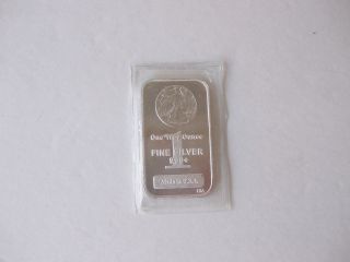 One Troy Oz.  999,  Fine Silver Bar With An American Walking Liberty Stamped In photo